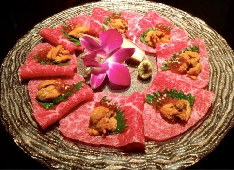 Signature dish “Lean Ozaki beef sashimi topped with sea urchin and salmon roe”