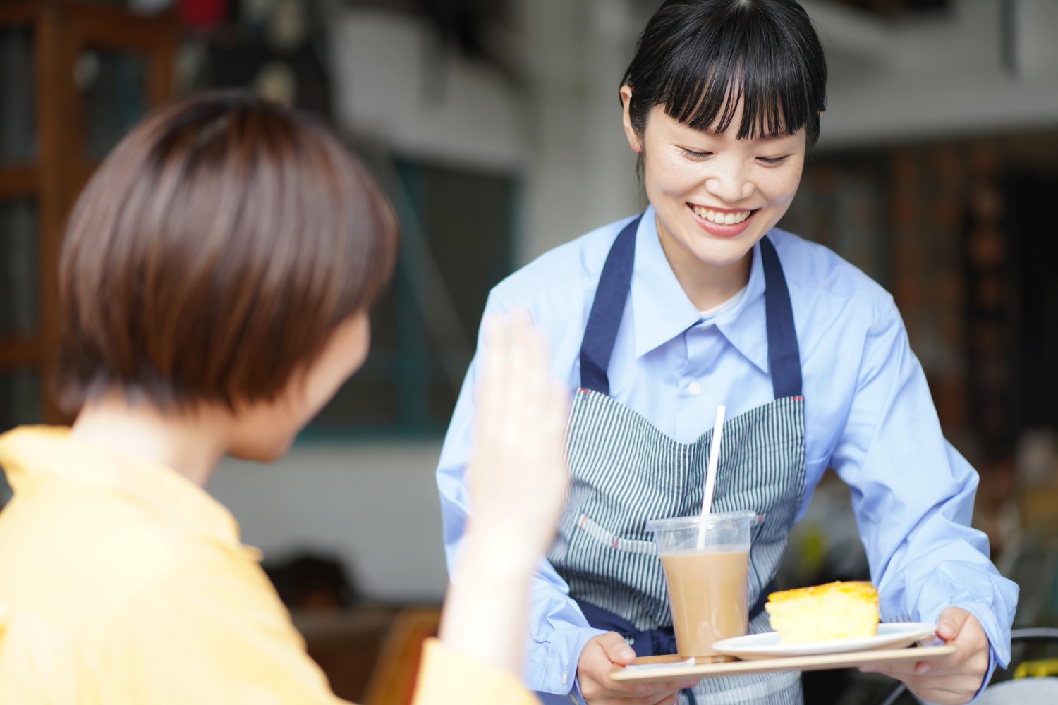 A staff member assisting a customer at a local business